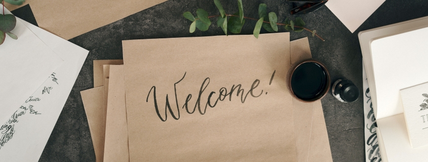 Welcome written in brush calligraphy