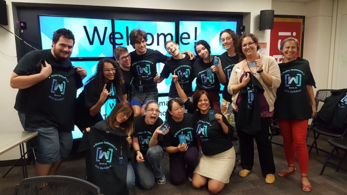A group of people making silly faces at the UA Women's Hackathon
